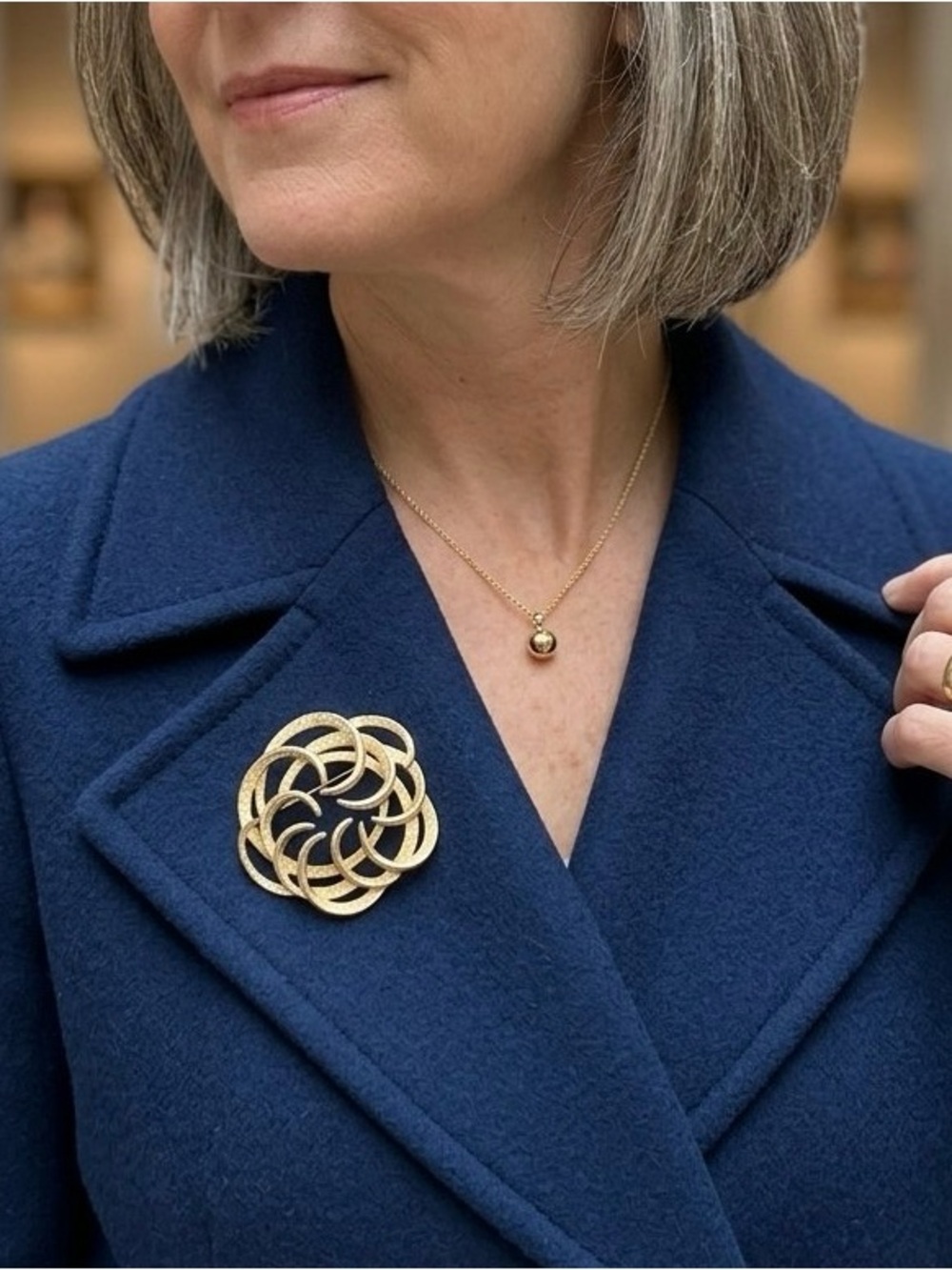 Sarah Coventry Circle Brooch with Large Gold Swirled Flower Design Stamped Logo